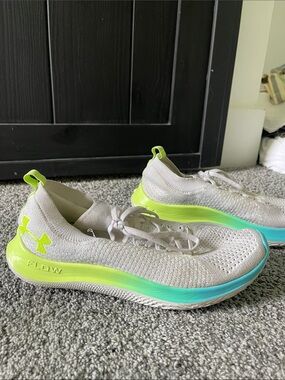 Under Armour Women’s Light Gray Knit Running Shoes with Neon Yellow Accents